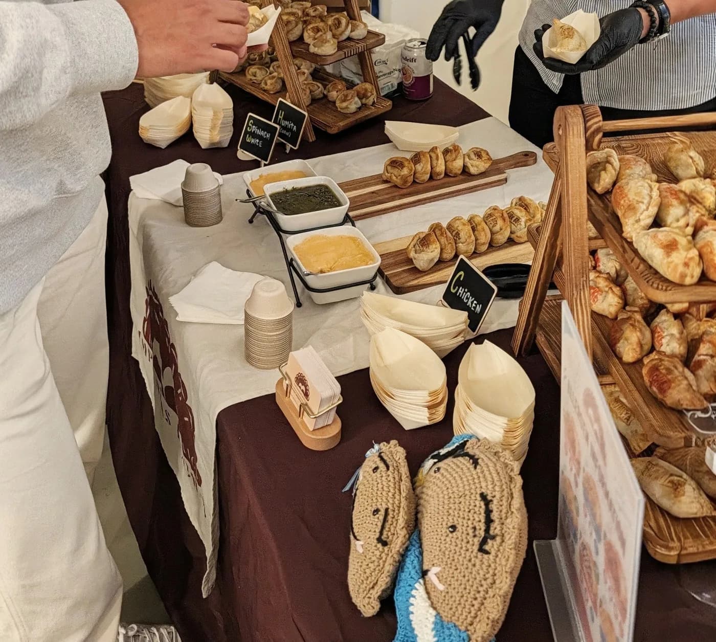 Our table at a pop-up event, stacked with empanadas