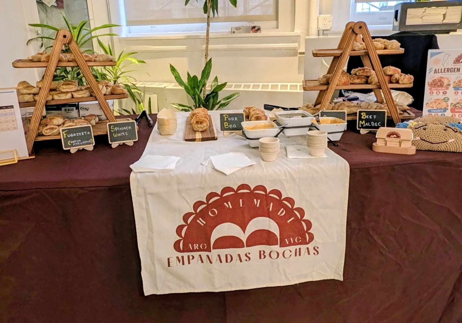 Empanadas Bochas table with our logo runner